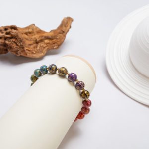 Rainbow - 8mm - 3 A stunning multi-colored beaded bracelet crafted using heritage jewelry techniques, merging Asian artistry with a modern minimalist aesthetic.